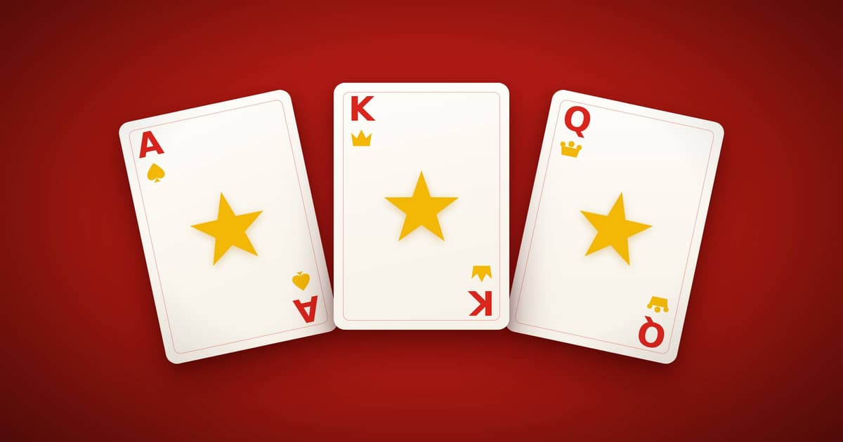 An ace, a king and a queen playing card, each marked with a gold star, on a red background